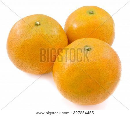 Three Ripe And Sweet Oranges On A Wooden Table, Orange Is The Fruit Of The Citrus Species Isolated O