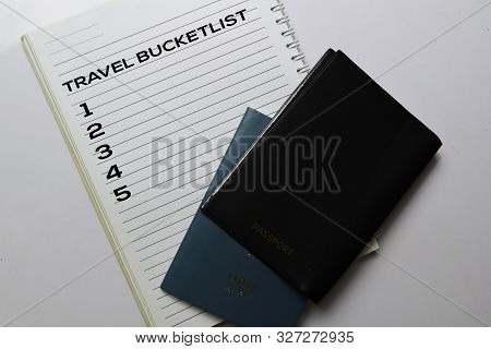 Passports And Travel Bucketlist Write On A Book Isolated White Background. Holiday Concept
