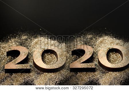 Happy New Year 2020. Creative Collage Of Numbers Two And Zero Made Up The Year 2020. Beautiful Spark