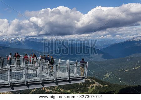 Whistler, Canada - August 25, 2019: People On The Cloudraker Skybridge Suspension Bridge.