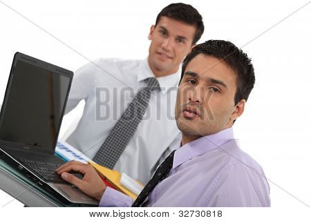 Young executives with a laptop