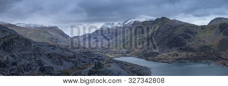 Stunning Landscape Image Of Dinorwig Slate Mine And Snowcapped Snowdon Mountain In Background During