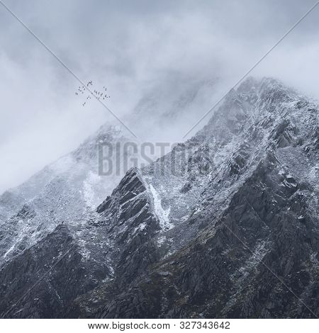 Stunning Detail Landscape Images Of Snowcapped Pen Yr Ole Wen Mountain In Snowdonia During Dramatic 