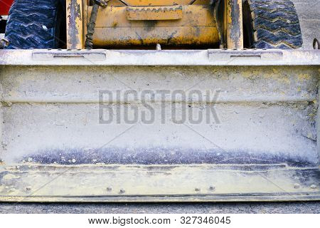 Dirty Tractor Bucket Closeup. Concept Of Construction, Repair. Old Working Construction Equipment. B