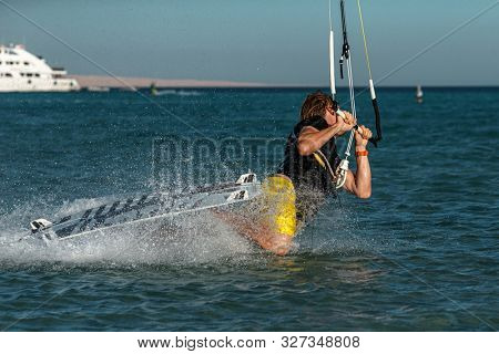 Kitesurfing on the waves of the sea in Mui Ne beach, Phan Thiet, Binh Thuan, Vietnam. Kitesurfing, Kiteboarding action photos Kitesurfer In action