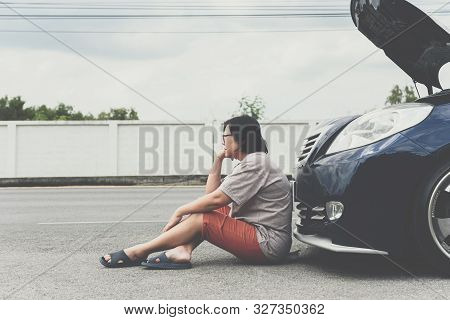 Woman Unhappy And Dismal From Car Engine Problem