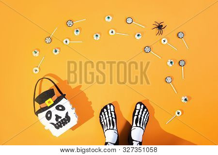 Happy Halloween Candy Bucket Face Of Jack O Lantern With Lollypops With Spiders And Nets On Orange B