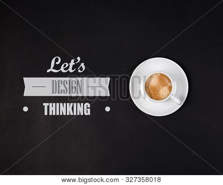 Designthinking Concept. Cup Of Coffee On Blackboard.