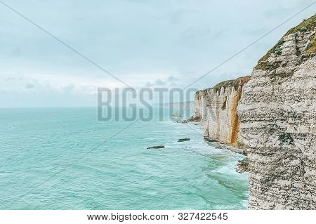 West Coast Of France. Étretat. Great View From A Great Height. The Sea Beats Against Rocks And Stone