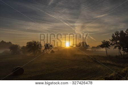 Color Sunrise With Fog On Meadows Near Pisek Town In South Bohemia