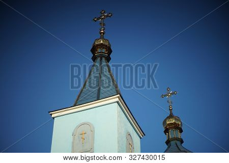 Beautiful Rural Orthodox Church Against The Blue Sky.