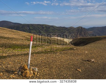 Red Mark On Trail Sign Pole On Famous Laugavegur Hiking Trail With Colorful Rhyolit Landmannalaugar 