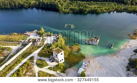 Sand Hills Of Quarry With A Pond And Abandoned Prison In Rummu Estonia Europe. Flooded Houses Of For