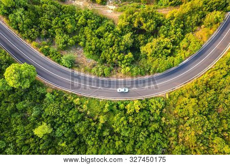 Aerial View Of Road With Car In Beautiful Forest At Sunset In Summer. Colorful Landscape With Asphal