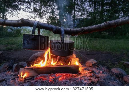Cooking Dinner At The Campfire. Camping Food.