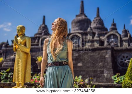 Young Woman Tourist In Budhist Temple Brahma Vihara Arama Banjar Bali, Indonesia