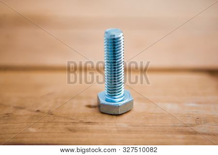 Metalware (bolt, Screw) On The Wooden Background