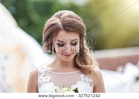 Portrait Of A Young Bride In A White Dress
