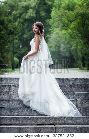 Portrait Of A Young Bride In A White Dress