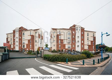Paris, France - Jul 14, 2011: Large Aprtment Complex Building With Street Pedestrians Crossroads And