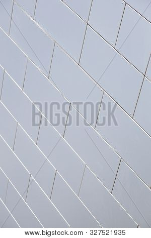 Close-up Of Smooth White Tiled Wall Of Building