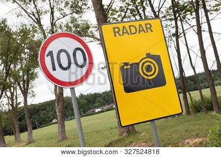 Roadsign Speen Limitation One Hundred Km And Tablet With Radiolocator.