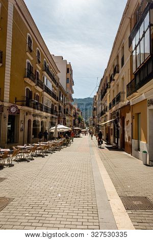 Denia, Valenciana, Spain - Sept 23 2019 : Streets Of Denia With Tourists Wandering Around.