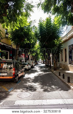 Denia, Valenciana, Spain - Sept 23 2019 : Streets Of Denia With Tourists Wandering Around.