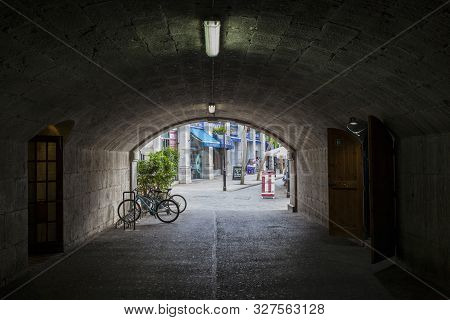 Gibraltar, Uk - July 27th 2019: Gate Of Landport Tunnel.  Grand Casemates Square At Bottom, Gibralta