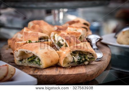 Little Stuffed Pizza With Escarole, Olives And Passed On The Wooden Board, Typical Neapolitan Food O