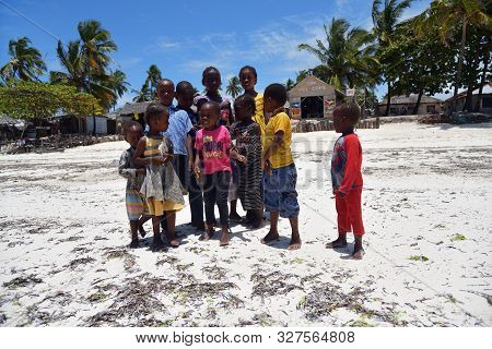 Pingwe, Zanzibar - October 6, 2019: Cheerful Happy Children On The Pingwe Beach, Local Village On Ba