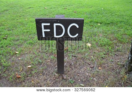 Brown Wood Sign With Letters Fdc In The Ground