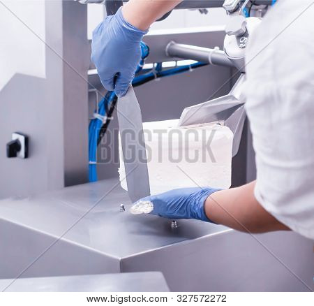 A Pastry Chef Shapes A Cake On A Pastry Shop. Cake Making On An Industrial Scale