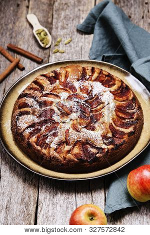 Eplekake. Traditional Norwegian Apple Cake Or Pie Sprinkled Sugar And Cinnamon On Old Rustic Wooden 