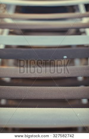 Old Aluminum Beach Loungers After The End Of The Summer Season. Aluminum Structures With Fabric Tape