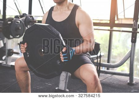 The Young Man Who Beginner Training With Free Weigth In Gym. Fitness Concept.fitness Muscular Body.