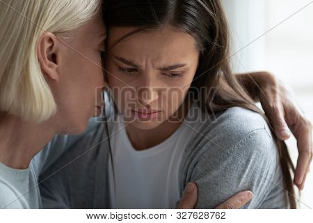 Empathic Middle Aged Woman Hugging Upset Daughter.