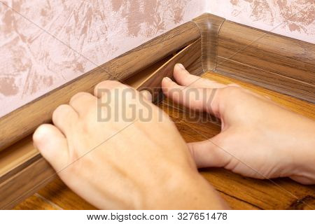 Installation Of Floor Plastic Skirting Boards In The Color Of A Laminate,baseboard Repair And Instal