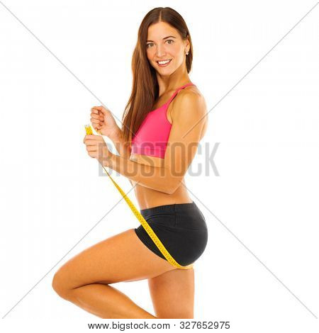 Fitness woman in sport weat. Beautiful body with measure tape on white background isolated