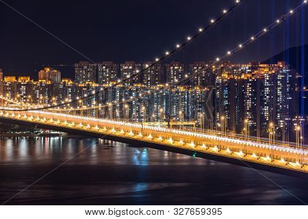 Sunset and light illumination of Tsing ma bridge landmark suspension bridge in Tsing yi area of Hong Kong China.