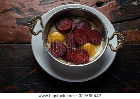 Turkish Sausage (sucuk) and egg isolated on rustic wooden table
