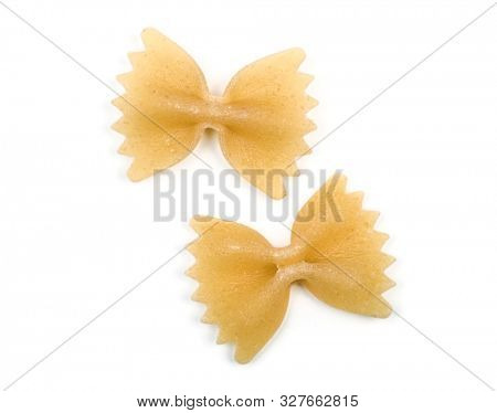Farfalle italian bow tie shape pasta macro view two particles isolated on white background with clipping parh