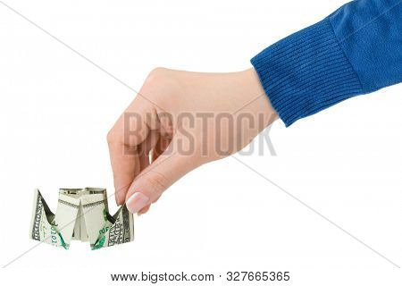 Hand launching money ship isolated on white background