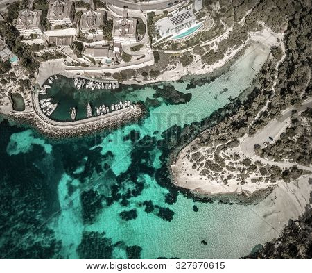 Beautiful birdeye view on the sea coastline with pier and yakhts at sunny day. Travell, jorney,islands, Seascape, freedom, holidays concept.