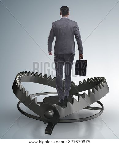 Man caught in mouse trap in risk business concept