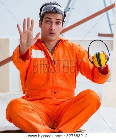 Worker showing the importnace of wearing noise cancelling headph