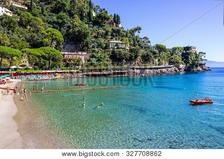 The Sand Beach Known As Paraggi Near Portofino In Genoa On A Blue Sky And Sea Background