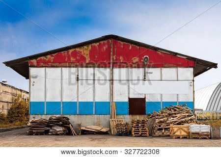 Close-up Of The National Flag Of Luxembourg Painted On The Metal Wall Of A Large Warehouse The Close