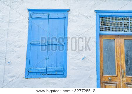 Hydra, Greek Island  Building Whitwashed With Blue Door And Shutter