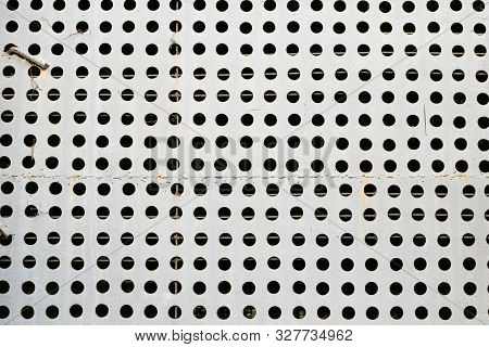 Abstract Metal Background With Round Holes. Texture. Gray Metallic Plate. Metalline Pattern.